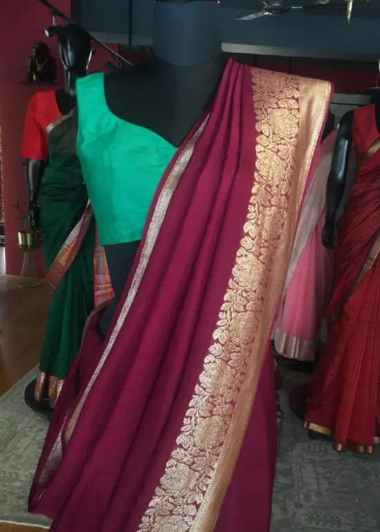 Burgundy Dola Silk Saree highlighted with Gold Zari Border