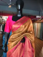 Peach Kora Silk Saree Highlighted With Zari Weaves