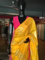 Yellow Dola Silk Saree highlighted with Silver Zari Buttas