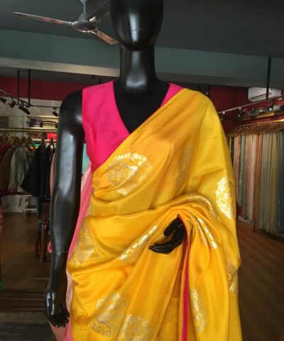 Yellow Dola Silk Saree highlighted with Silver Zari Buttas