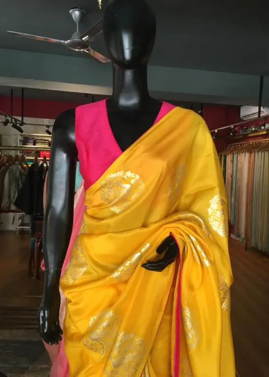Yellow Dola Silk Saree highlighted with Silver Zari Buttas