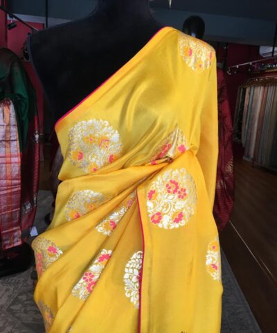 Yellow Dola Silk Saree Highlighted With Silver Zari Buttas