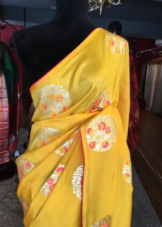 Yellow Dola Silk Saree Highlighted With Silver Zari Buttas