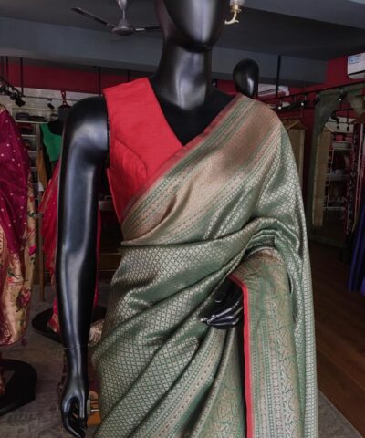 Green Banarasi Silk Saree highlighted with contrast piping