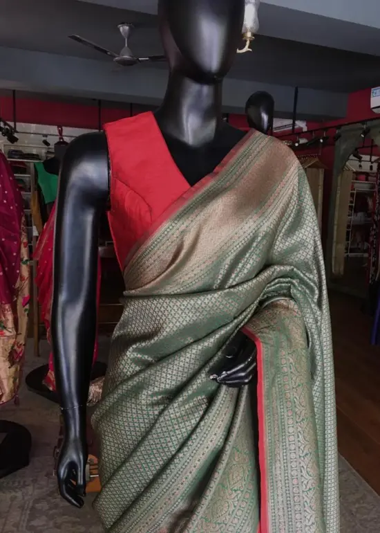 Green Banarasi Silk Saree highlighted with contrast piping