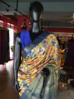 Yellow Printed Banarasi Silk Saree highlighted with contrast border