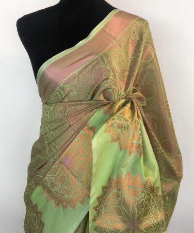 Pista Green Kora Silk Saree highlighted with zari weaves