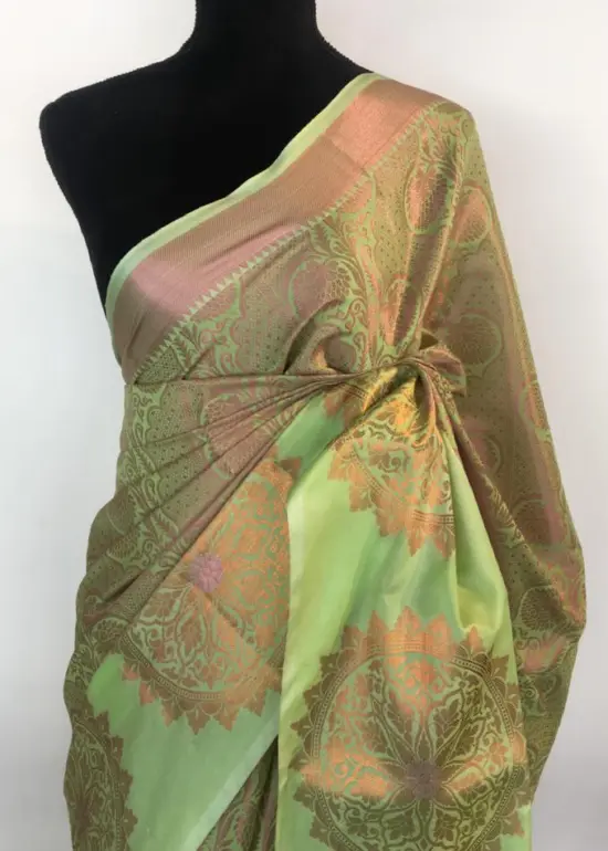 Pista Green Kora Silk Saree highlighted with zari weaves