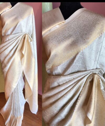 Off White Banarasi Silk Saree highlighted with Gold and Silver zari weaves