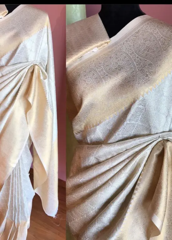Off White Banarasi Silk Saree highlighted with Gold and Silver zari weaves