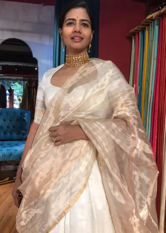 Off White Silk Lehenga with woven zari weaves