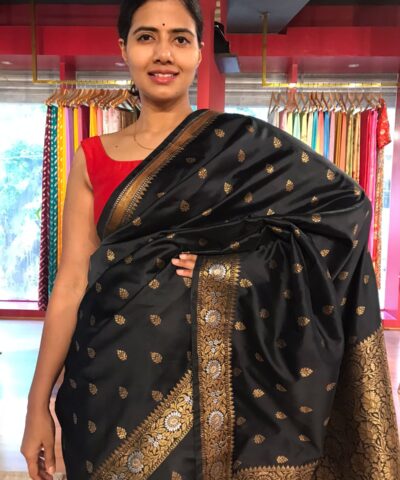Black Banarasi Silk Saree highlighted with Gold Zari Buttas