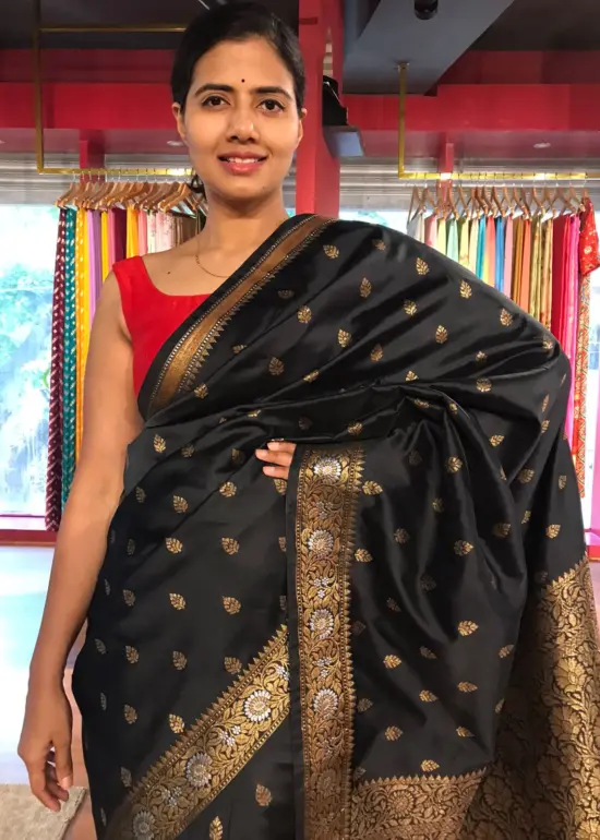 Black Banarasi Silk Saree highlighted with Gold Zari Buttas