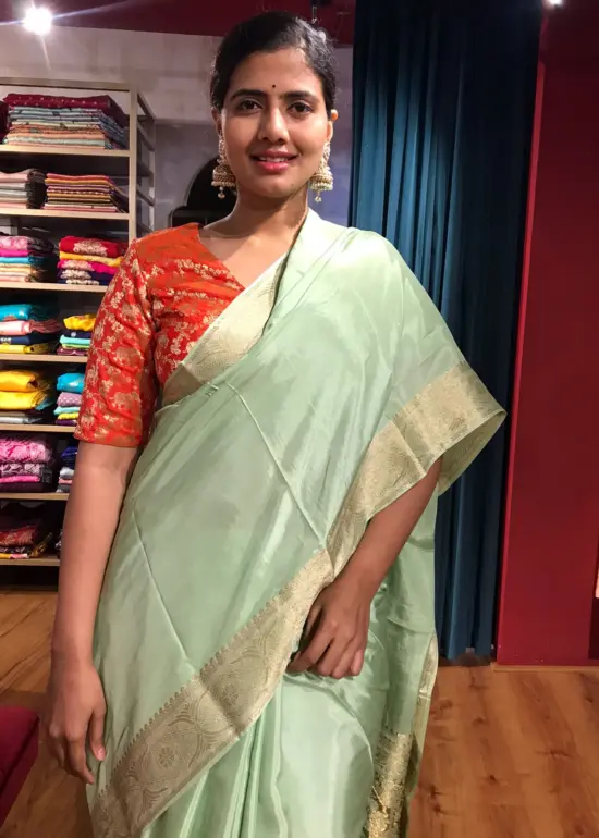 Mint Dola Silk Saree highlighted with Gold Zari Border