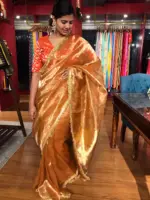Orange Tissue Silk Saree woven with Beautiful Gold Zari Buttis - Image 3