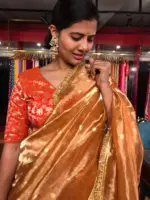 Orange Tissue Silk Saree woven with Beautiful Gold Zari Buttis