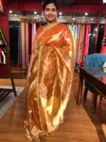 Orange Tissue Silk Saree woven with Beautiful Gold Zari Buttis - Image 4