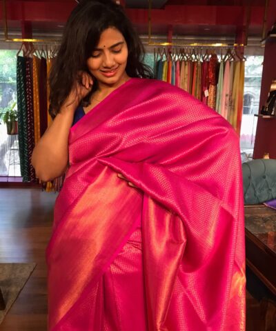 Hot Pink Banarasi Silk Saree highlighted with Gold Zari Weaves