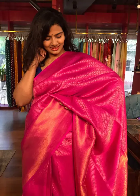Hot Pink Banarasi Silk Saree highlighted with Gold Zari Weaves