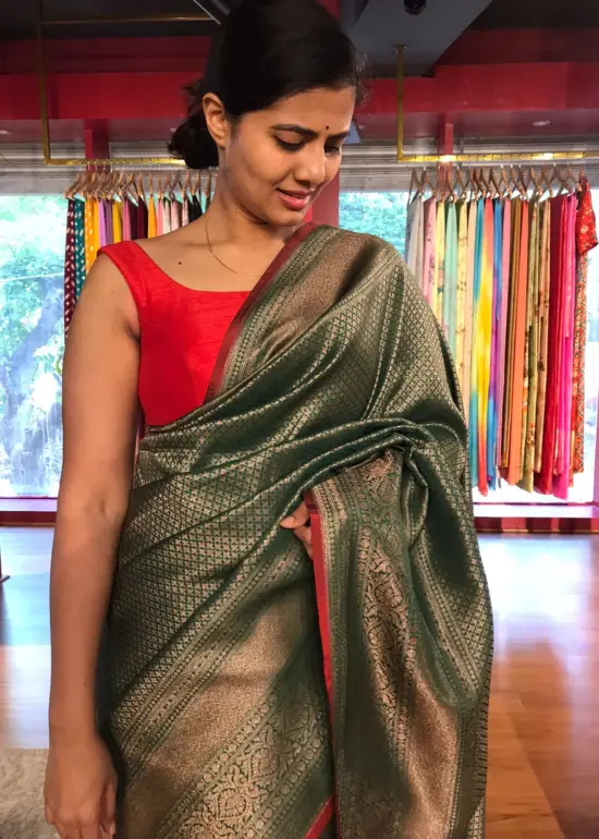 Bottle Green Banarasi Silk Saree highlighted with Antique Gold Zari  Weaves