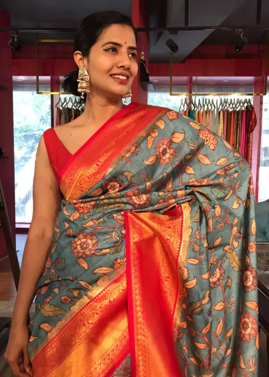 Blue Banarasi Silk Saree highlighted with Kalamkari Prints and Silk Border