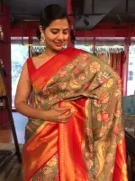 Green Banarasi Silk Saree highlighted with Kalamkari Prints and Silk Border
