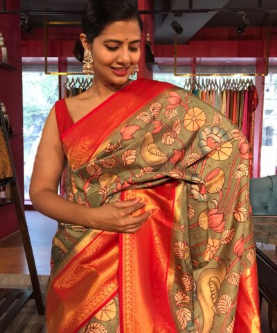 Green Banarasi Silk Saree highlighted with Kalamkari Prints and Silk Border