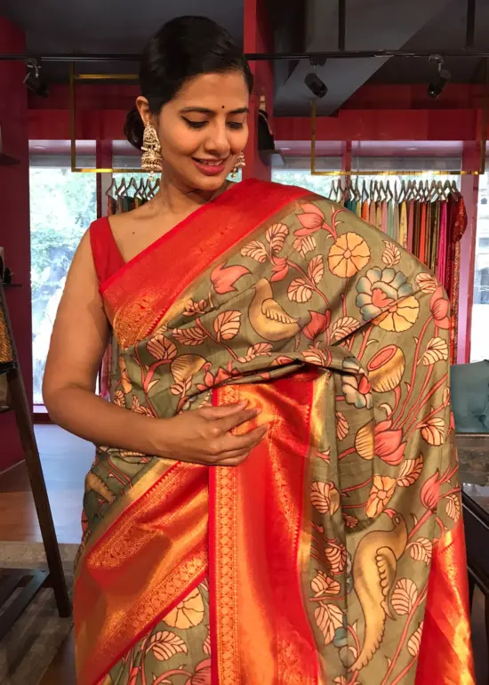 Green Banarasi Silk Saree highlighted with Kalamkari Prints and Silk Border
