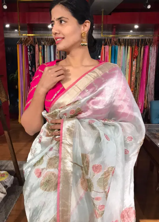 Baby Blue Tissue Silk Saree highlighted with Hand painted Florals and hand embroidery