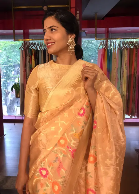 Peach Tissue Silk Saree with woven Shikargarh Motifs