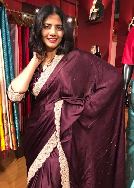 Burgundy Crepe Silk Saree highlighted with Hand Embroidery and Badla Work