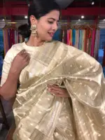 Gold Silver Tissue Silk Saree highlighted with Zari Buttis
