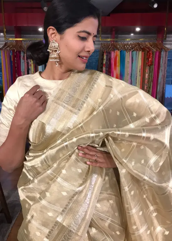 Gold Silver Tissue Silk Saree highlighted with Zari Buttis