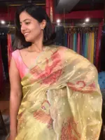Pista Green Hand Embroidered and Hand painted Tissue Silk Saree highlighted with Scalloped Border