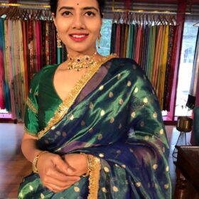 Peacock Dual Tone Tissue Silk Saree highlighted with Zari Motifs and Gota Border