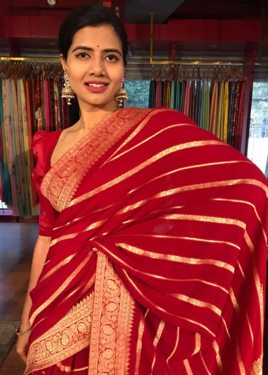 Red Banarasi Silk Saree in Georgette highlighted with Pichwai Weaves