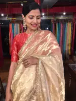Ivory Tissue Silk Saree highlighted with Zari Motifs and Gota Border
