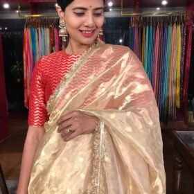 Ivory Tissue Silk Saree highlighted with Zari Motifs and Gota Border