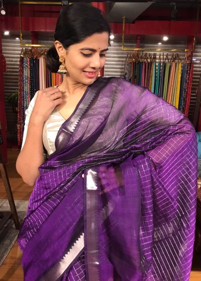Close up view of a model showcasing Purple Mangalagiri Silk Saree Handwoven in Chequered Pattern, Suitable for Weddings By Mirra Clothing