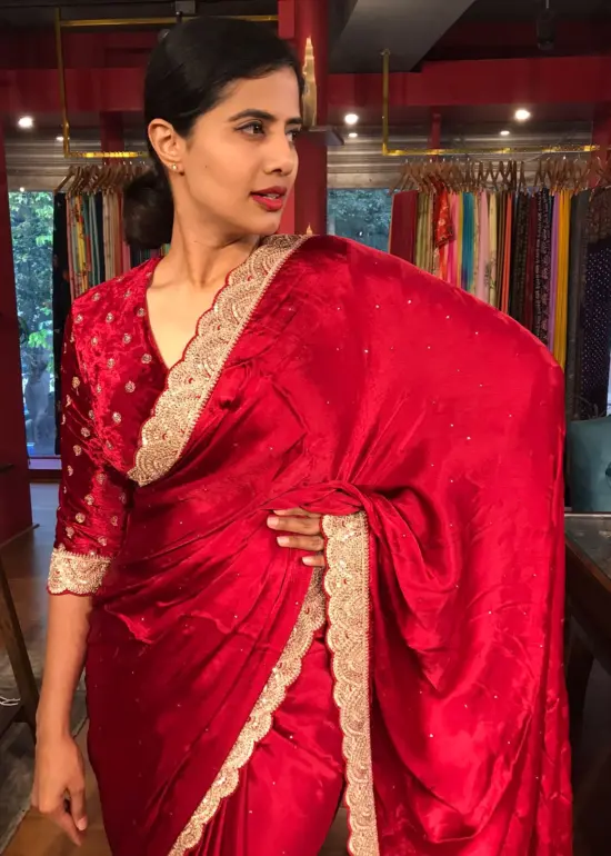Dark Red Crepe Silk Saree highlighted with Hand Embroidery
