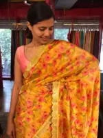 Yellow Printed Tissue Georgette Silk Saree highlighted with Embroidered Border