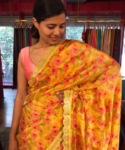 Yellow Printed Tissue Georgette Silk Saree highlighted with Embroidered Border