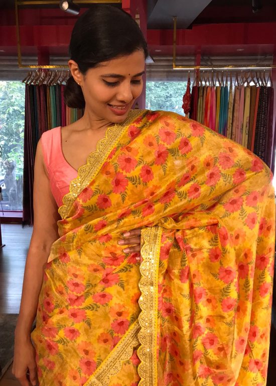 Yellow Printed Tissue Georgette Silk Saree highlighted with Embroidered Border
