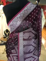 Maroon Banarasi Silk Saree highlighted with Silver Buttis