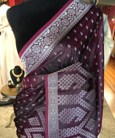 Maroon Banarasi Silk Saree highlighted with Silver Buttis