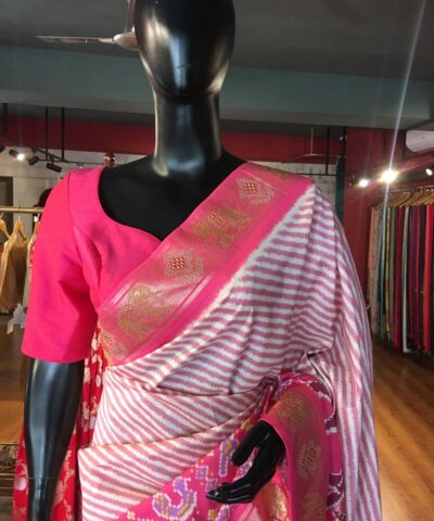 Offwhite Banarasi Soft Silk Saree highlighted with Patola Weaves