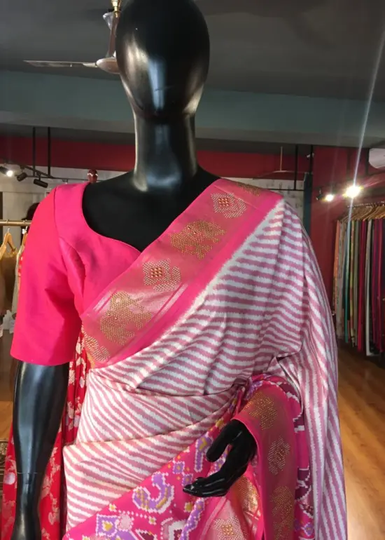 Offwhite Banarasi Soft Silk Saree highlighted with Patola Weaves