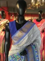Offwhite Banarasi Soft Silk Saree highlighted with Patola Weaves
