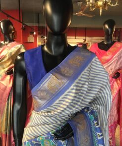 Offwhite Banarasi Soft Silk Saree highlighted with Patola Weaves