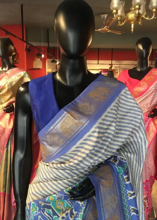 Offwhite Banarasi Soft Silk Saree highlighted with Patola Weaves